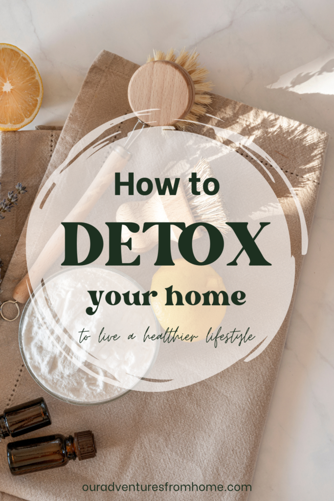 Cleaning supplies laid on counter with words how to detox your home over them