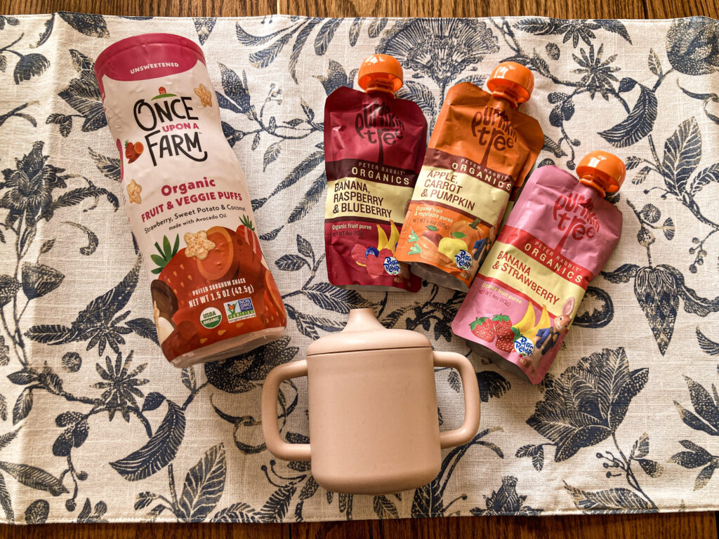 baby food pouches and cup on table for kids easter basket