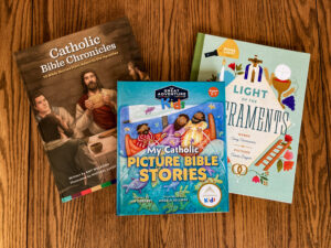 three religious children's books on table