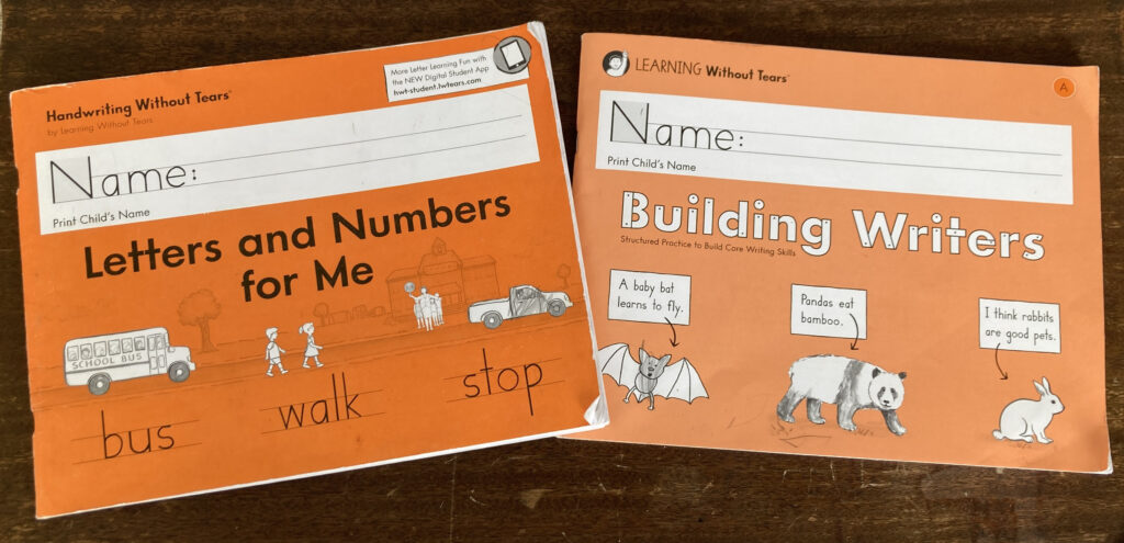 Handwriting Without Tears kindergarten curriculum workbooks on table