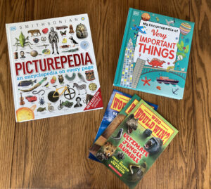 Kids in fiction books on table