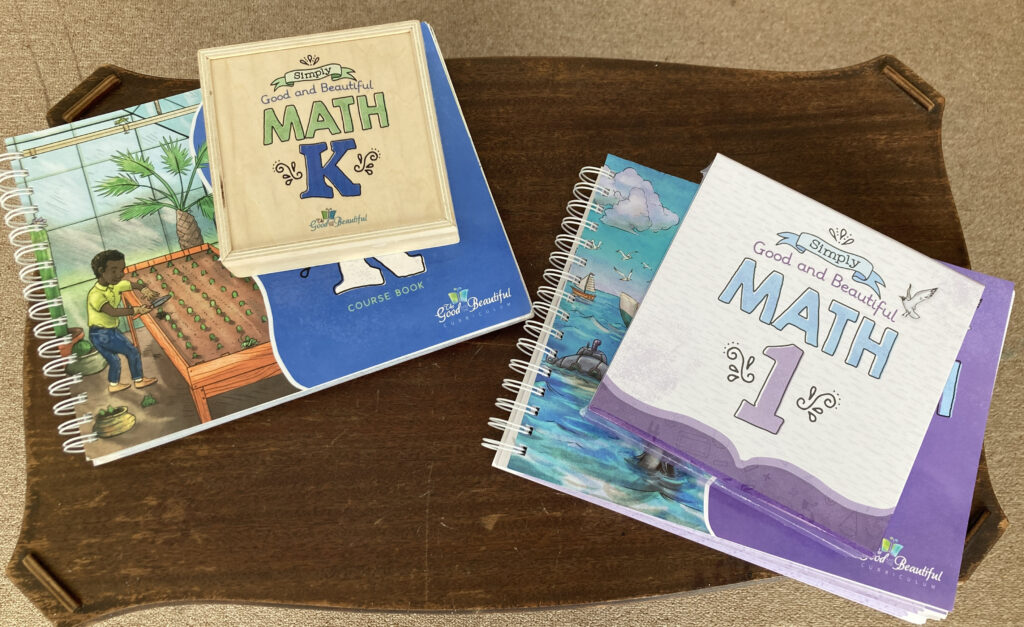Overhead shot of the Good and the Beautiful kindergarten and first grade math curriculum books