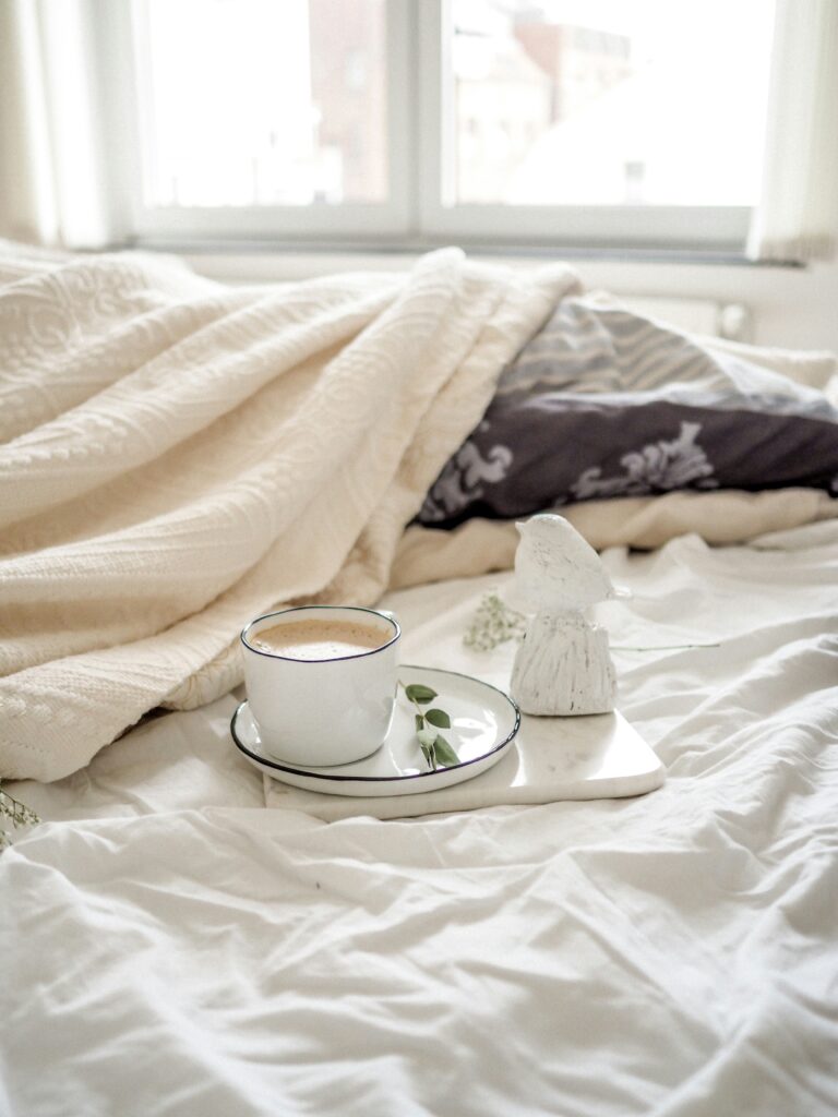 morning cup of coffee in a cozy bed
