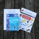 Summer learning materials placed on a picnic table