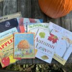 Spread of picture books laid on a picnic table